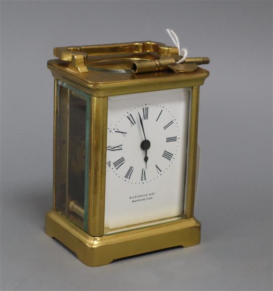 A Eustance & Co brass carriage timepiece with key